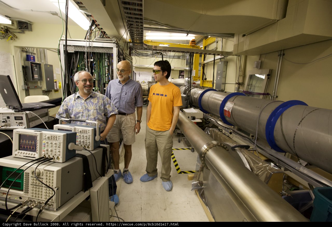 Three Men in a Technology Workshop