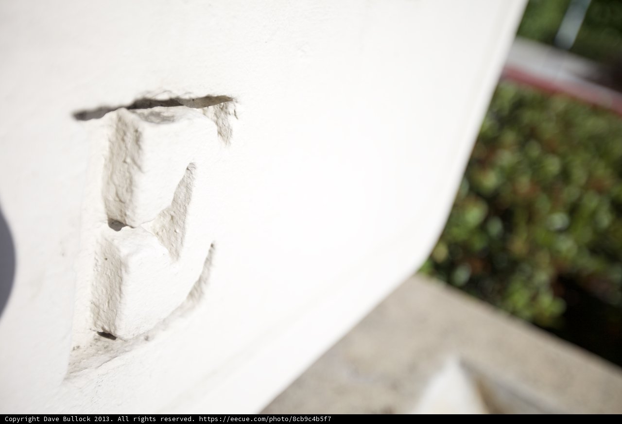 The Letter E Stands Tall on White Wall