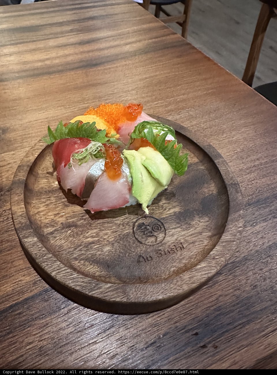 Savor the Flavors of Fresh Sushi on a Wooden Plate
