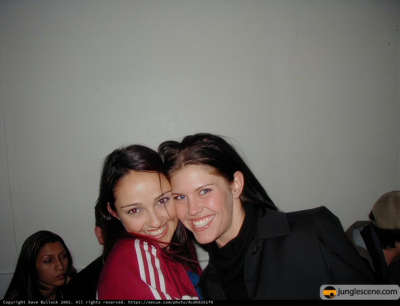 Two Happy Brides Pose for a Portrait