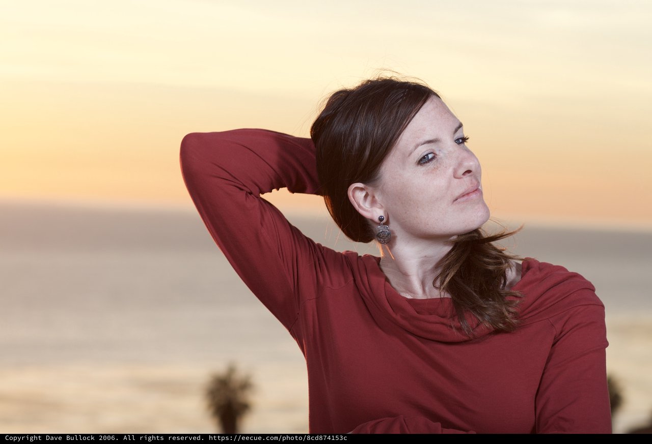 Woman in Red at Golden Hour Seaside