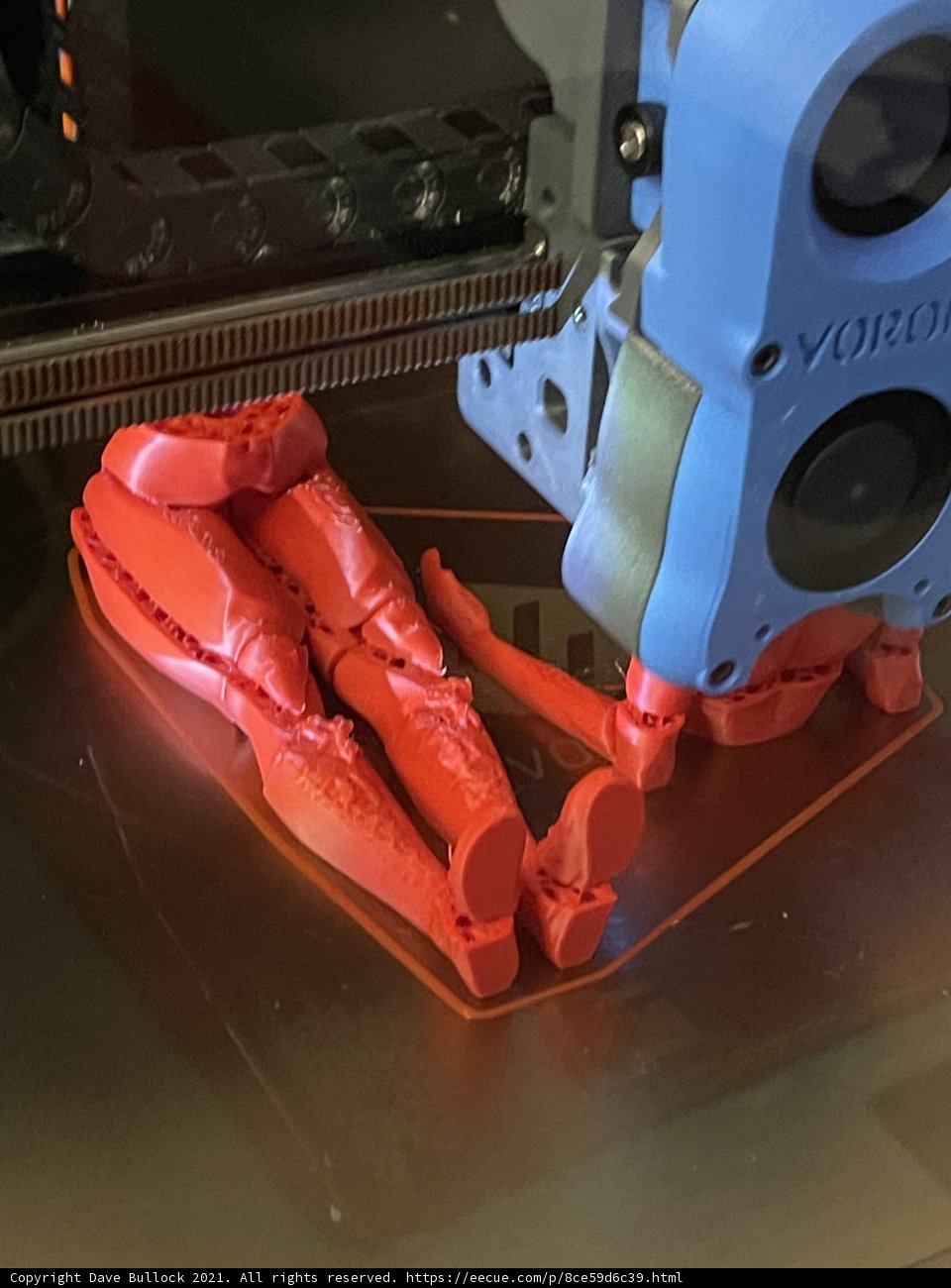 3D Printed Robot with a Red Arm