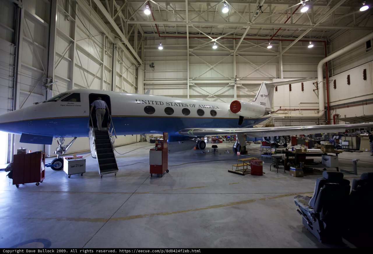 Blue and White Aircraft in Hangar