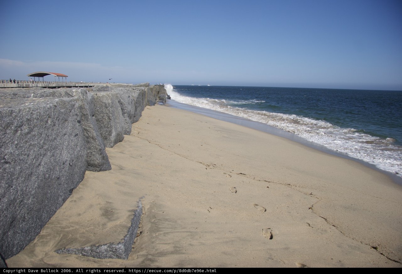 Serene Shoreline with Majestic Cliffs