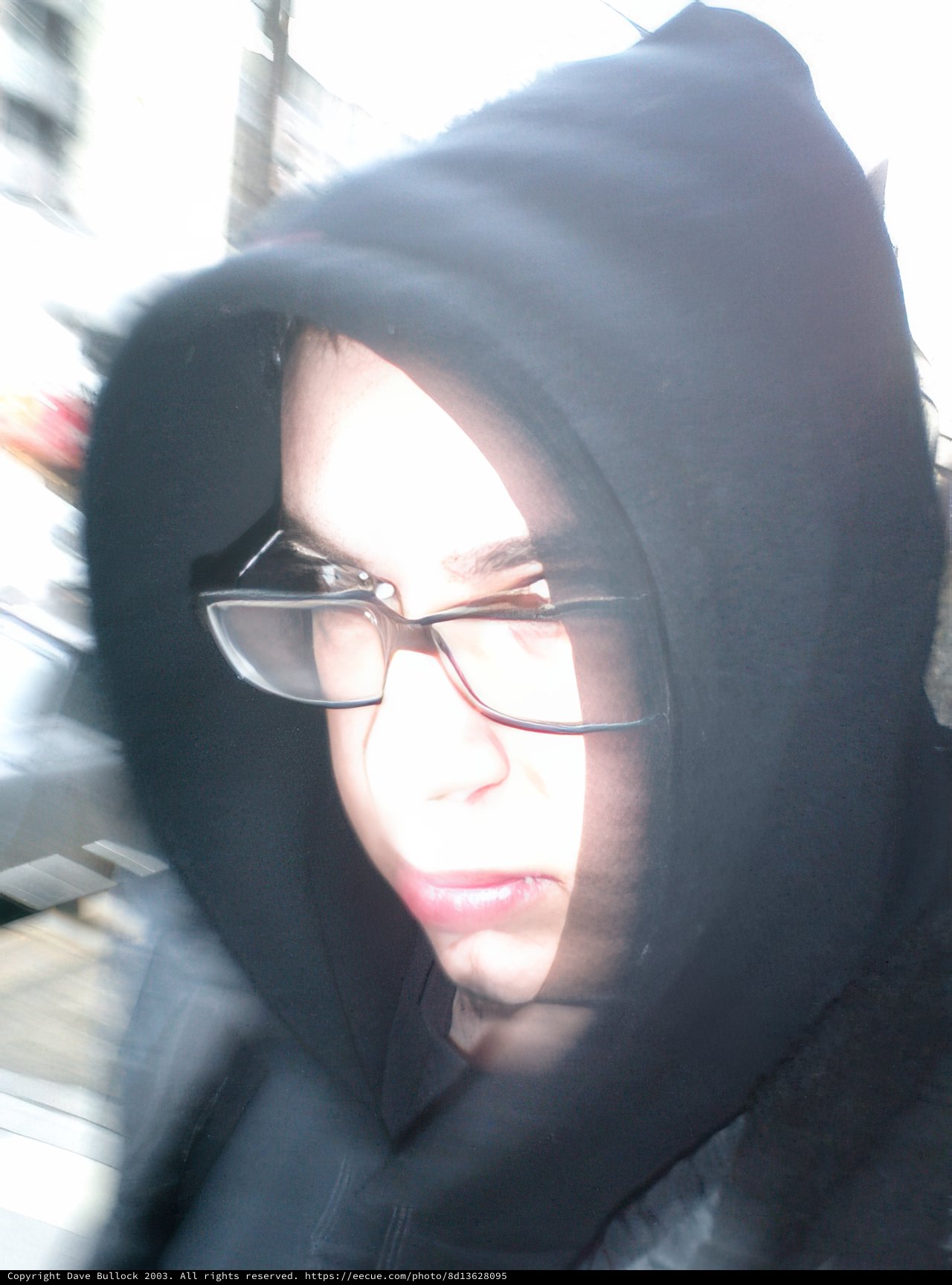 Blurry Portrait of Woman in Black Hoodie