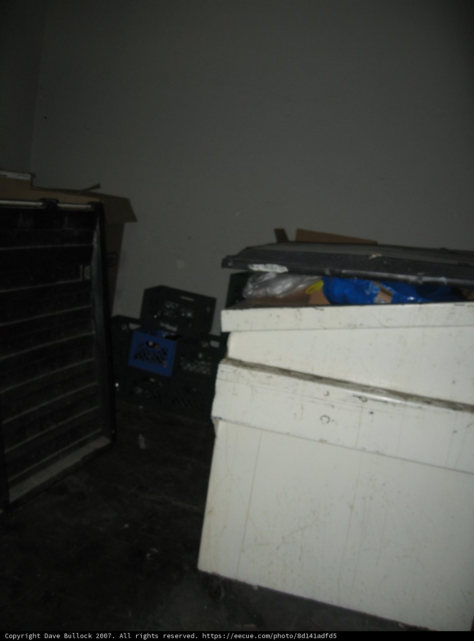 White Box with Blue Lid on Wooden Floor