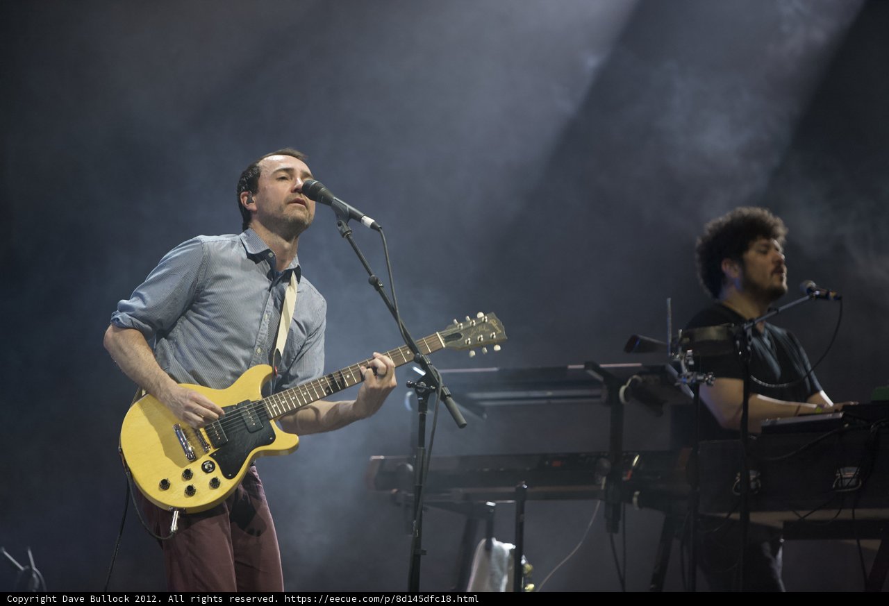 Rocking the Stage: Two Men Playing Guitar and Singing