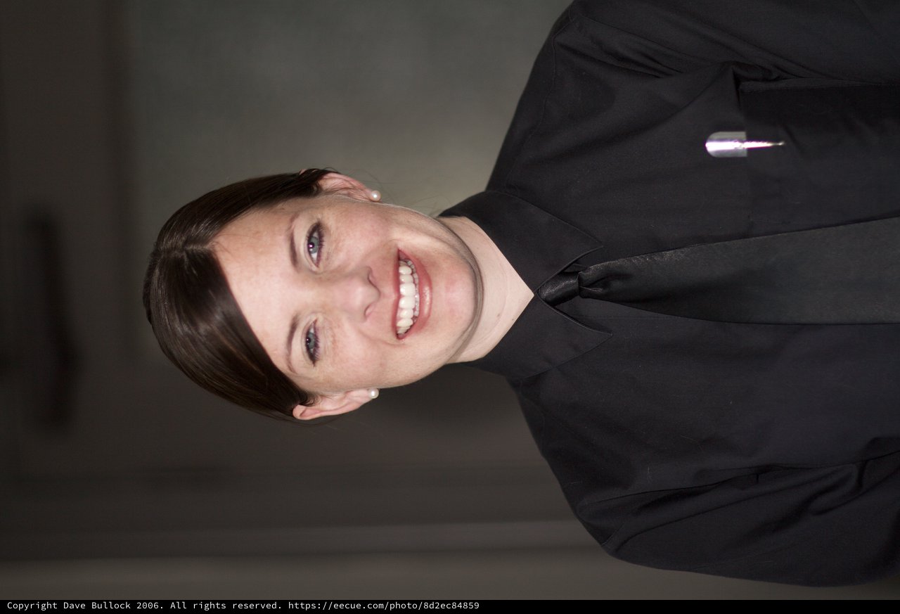Smiling Service Professional in Black Uniform Portrait