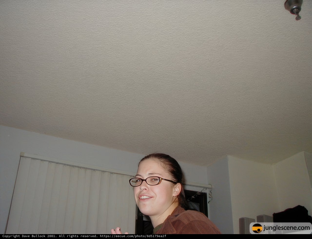 Remote Control in Hand and Glasses on Face