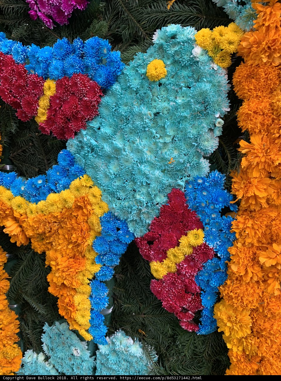 Floral Display with Feathered Friend