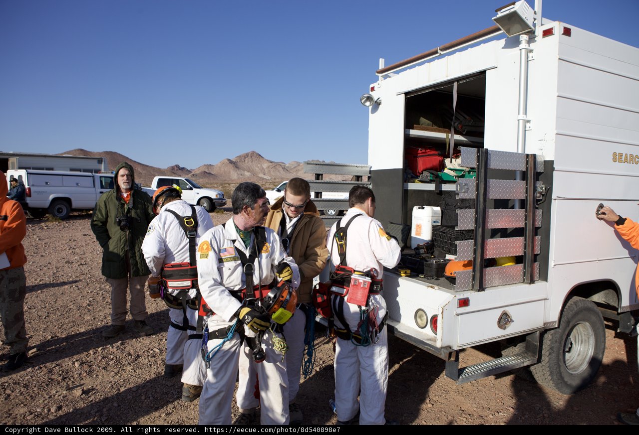 Mine Rescue Team Gathers Around White Truck
