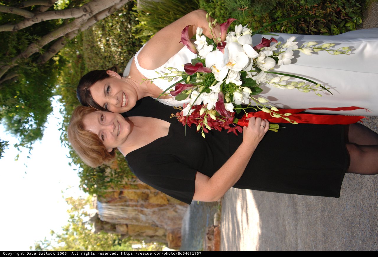 Bride and Friend Embrace Before Wedding Ceremony