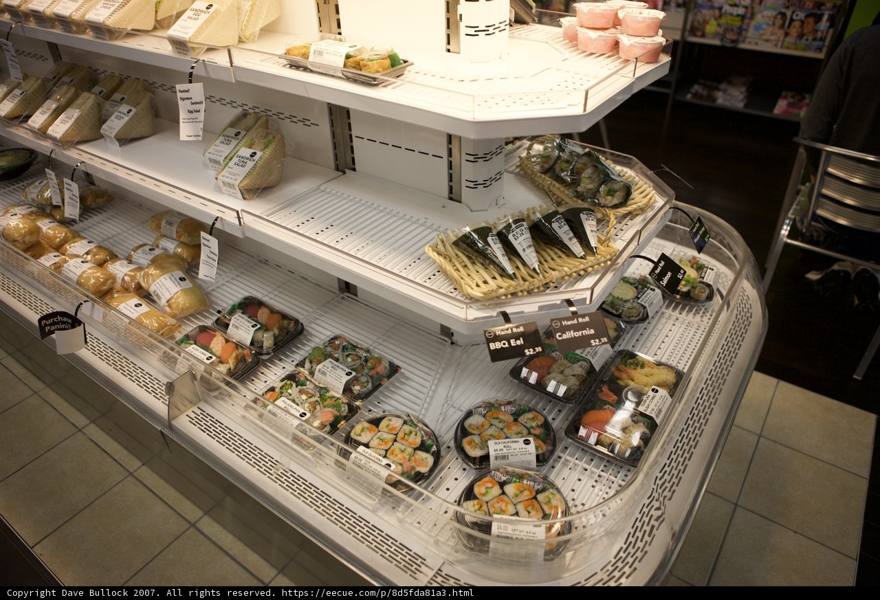 A Deli Display Case Filled with Sushi and More