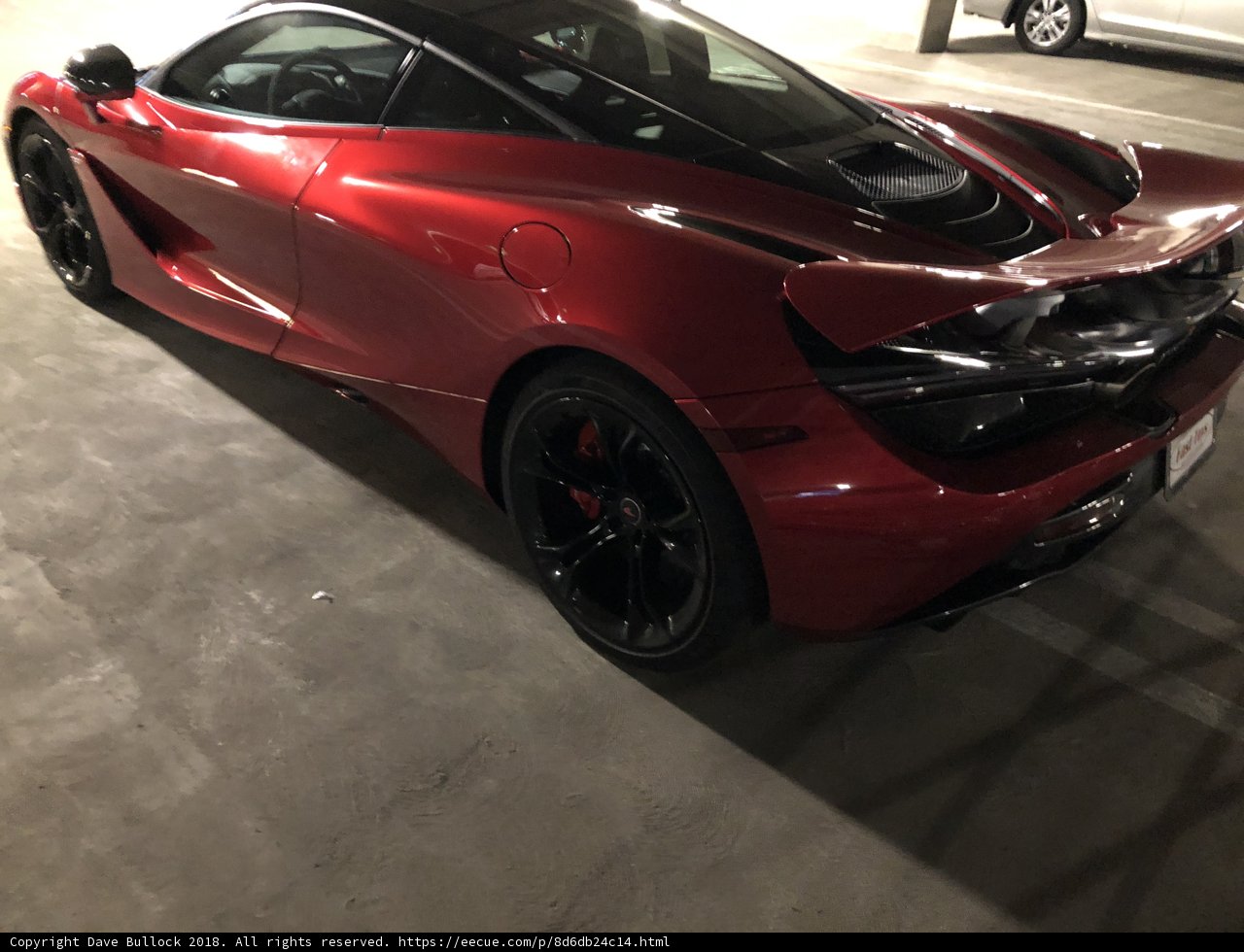 Parked Red McLaren 720s in Garage