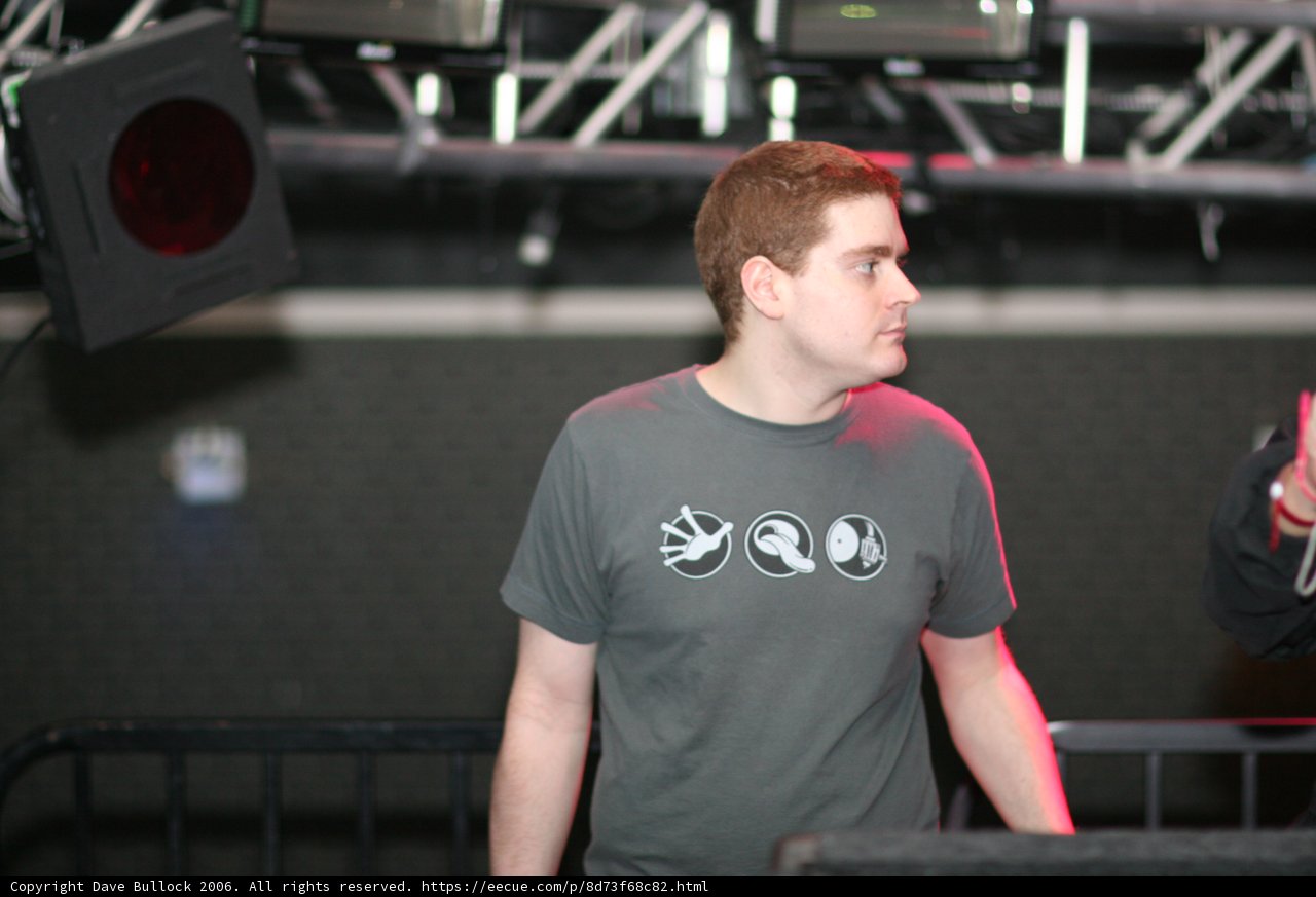 Grey-Shirted Man Commands the Stage