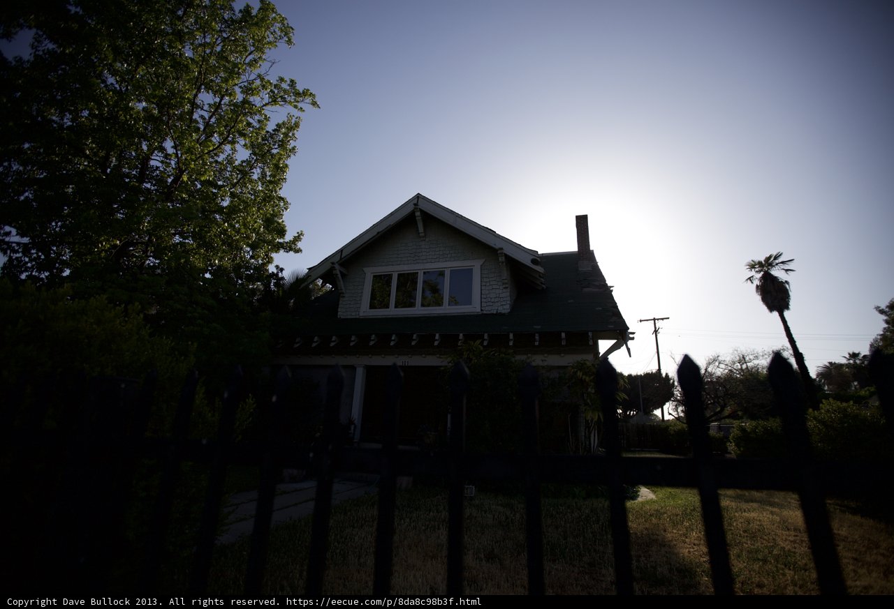 Sun-kissed House with Picket Fence