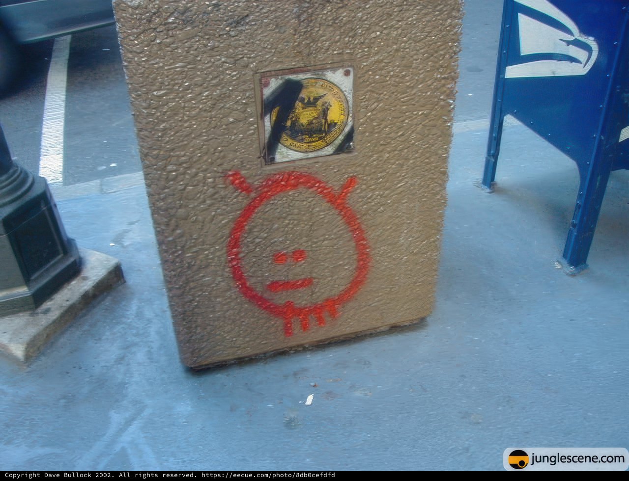 Red Sticker on Cement Box with Face