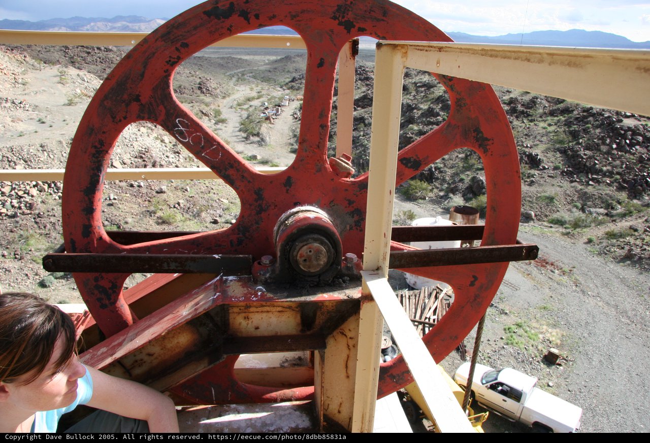 Rusty Red Flywheel at Desert Mining Site