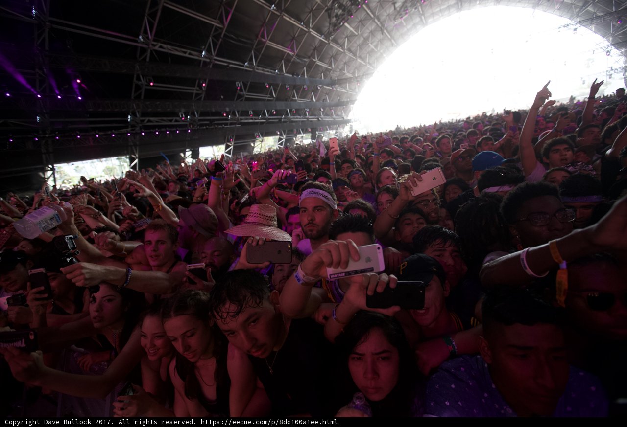 Coachella Crowd Goes Wild Caption: A sea of hands and excitement at Coachella 2017 as the crowd revels in the music and energy of the event.