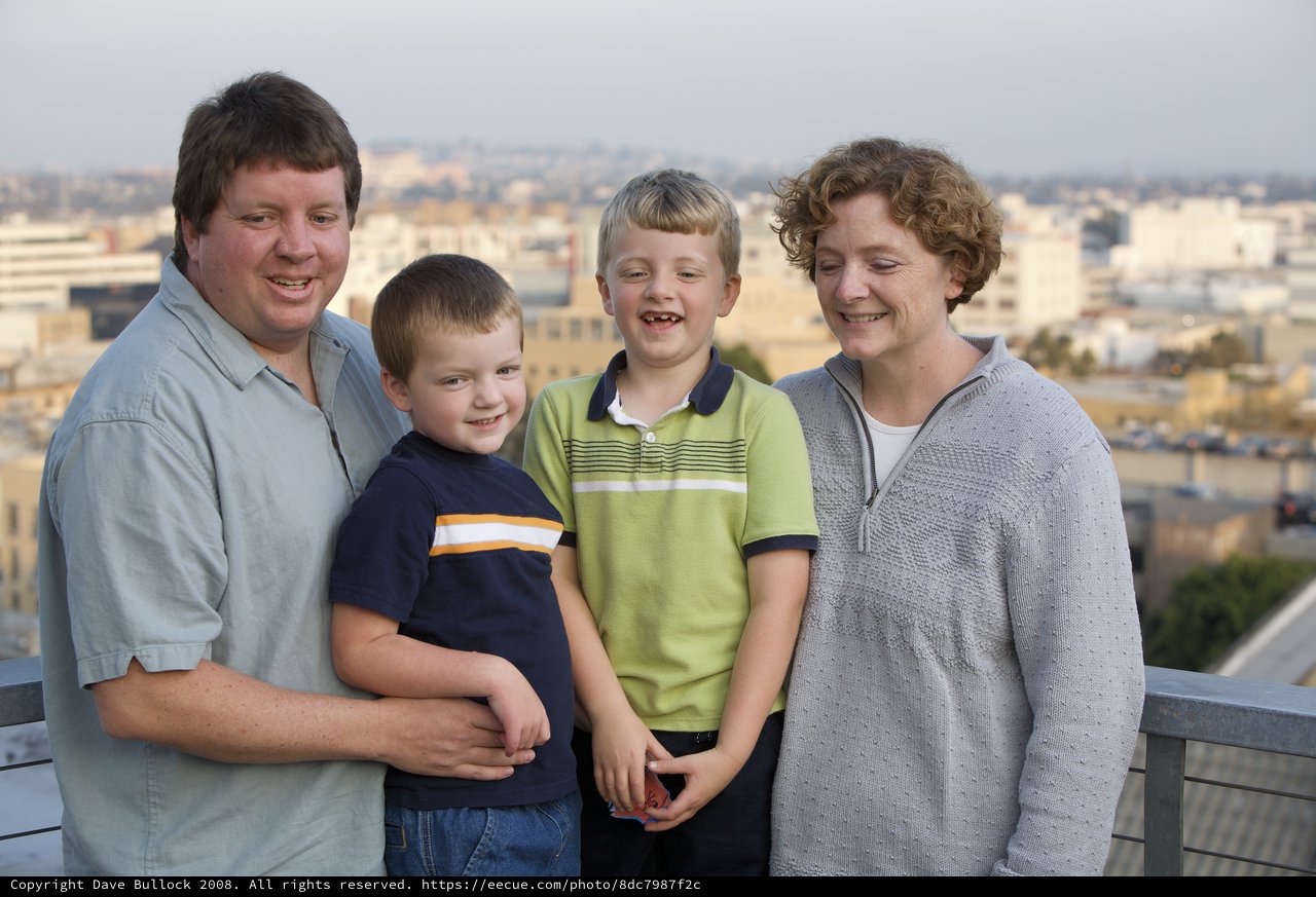 Family Portrait on Urban Rooftop at Dusk