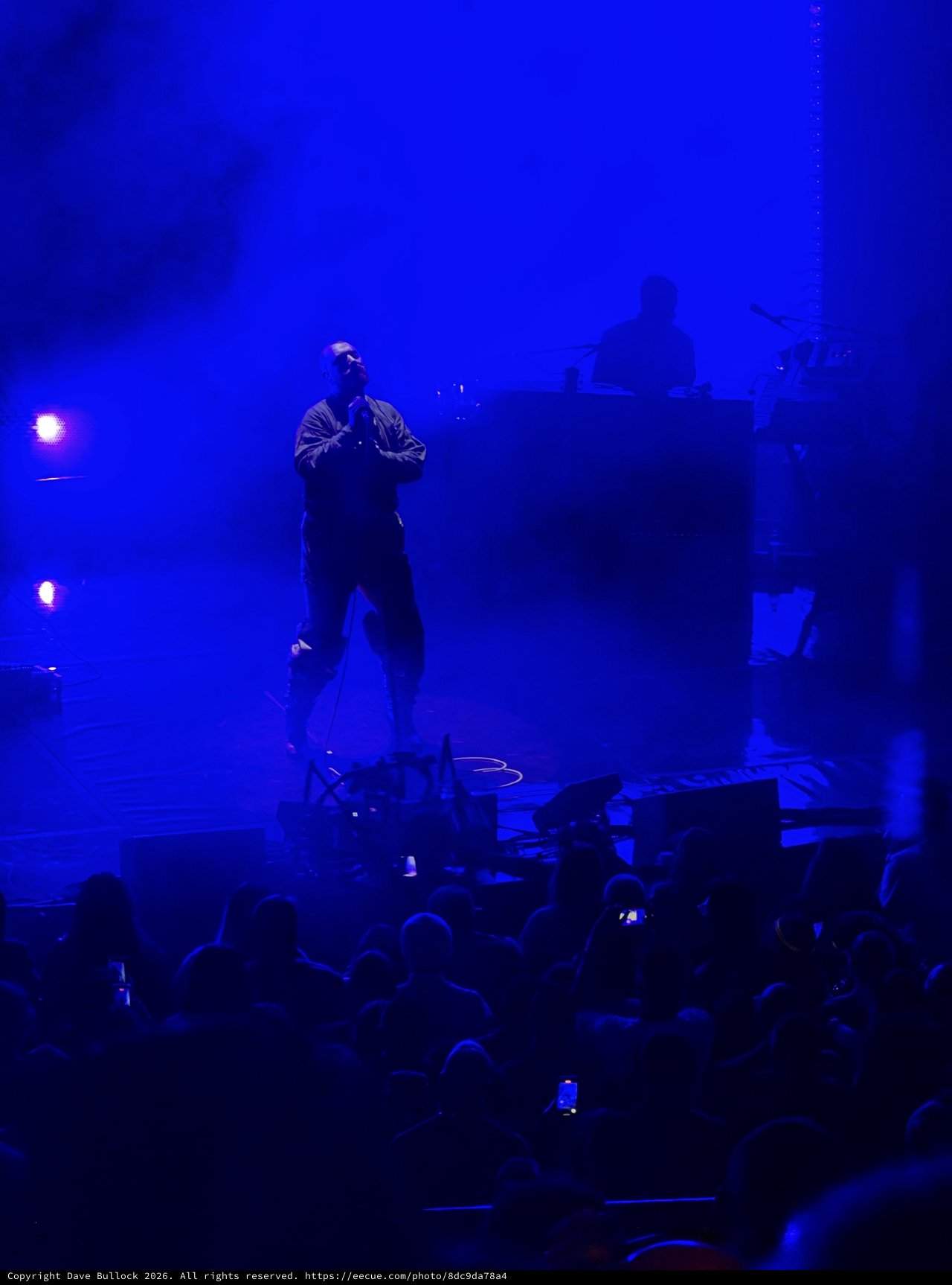 Concert Performer in Dramatic Blue Stage Lighting