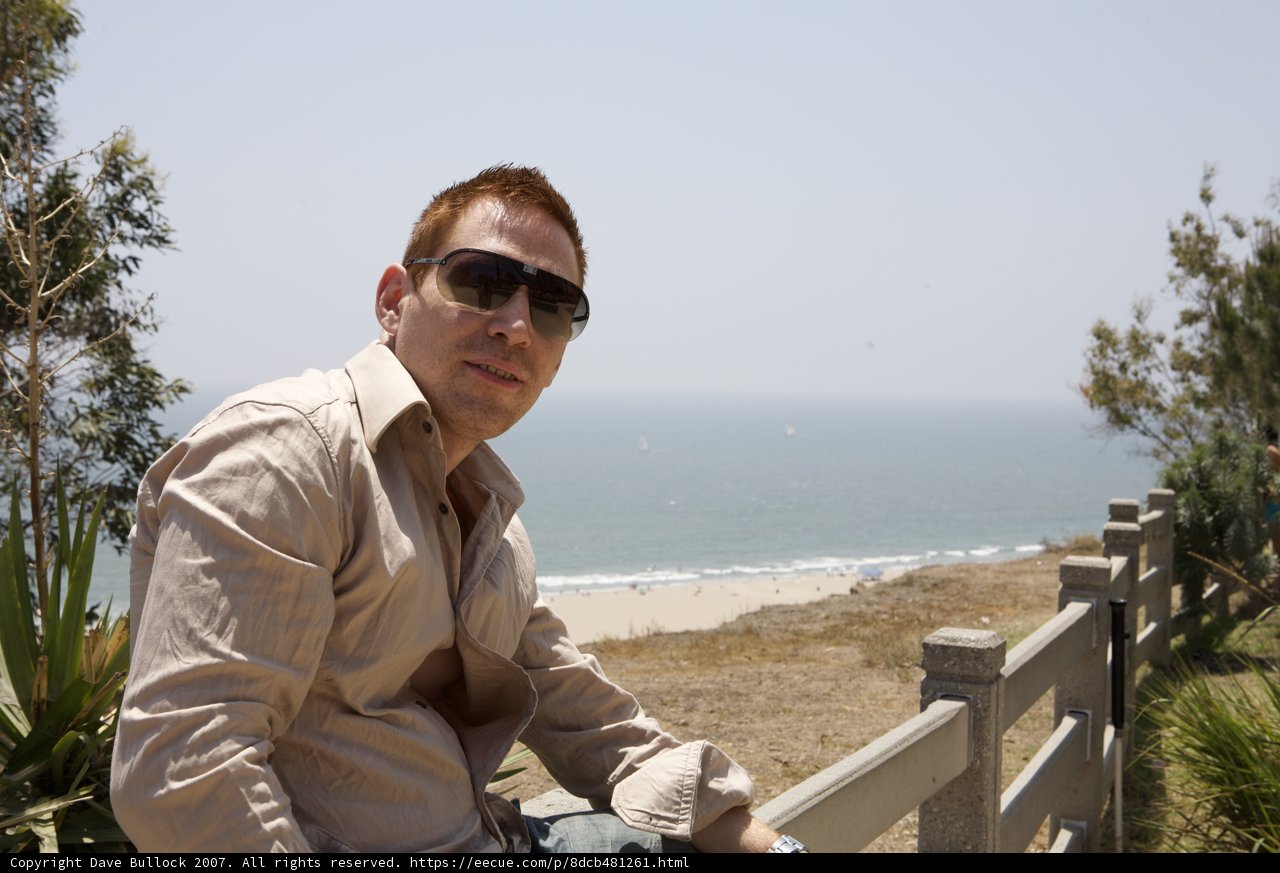 Man on Wood Handrail at the Beach