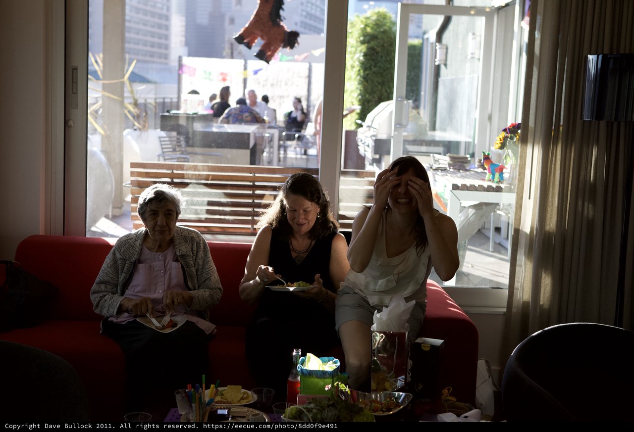 Three Generations Share Laughter at Fiesta Party