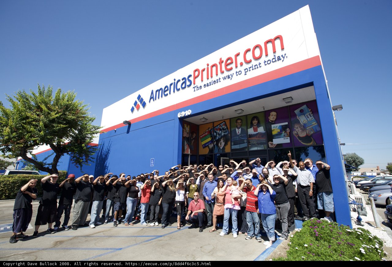 Group of Distinguished Guests Pose in Front of Building
