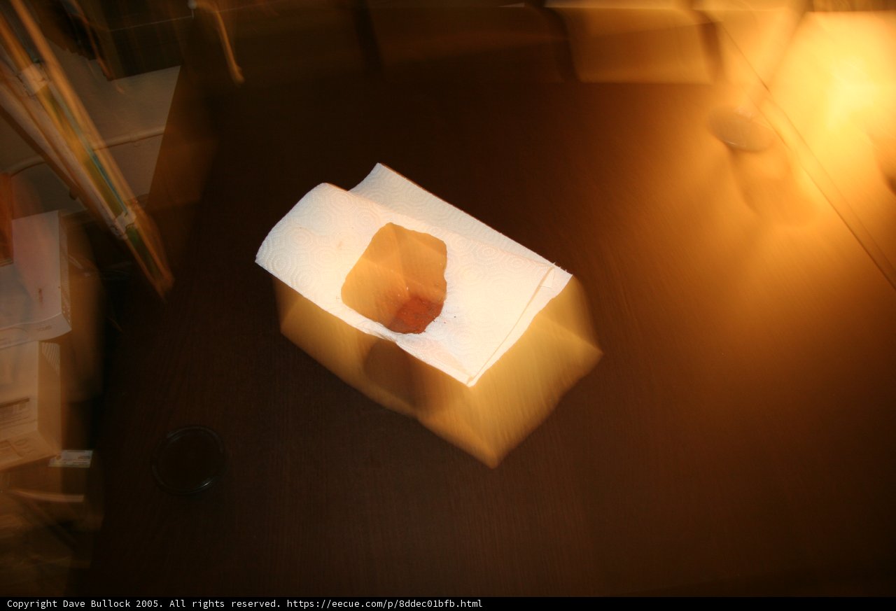 White Paper Bag on Wooden Table