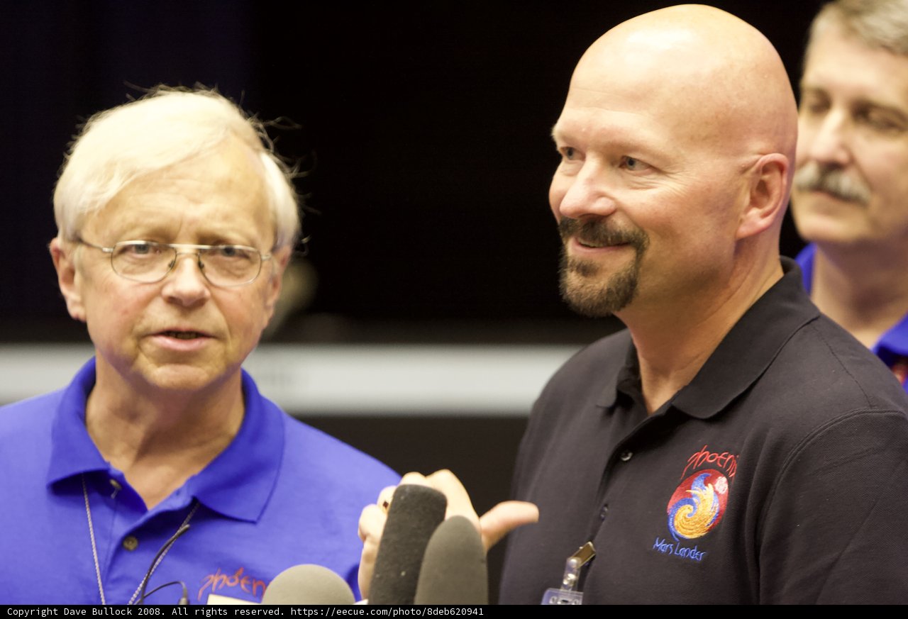 Two Men in Blue Shirts at Phoenix Post-Interview