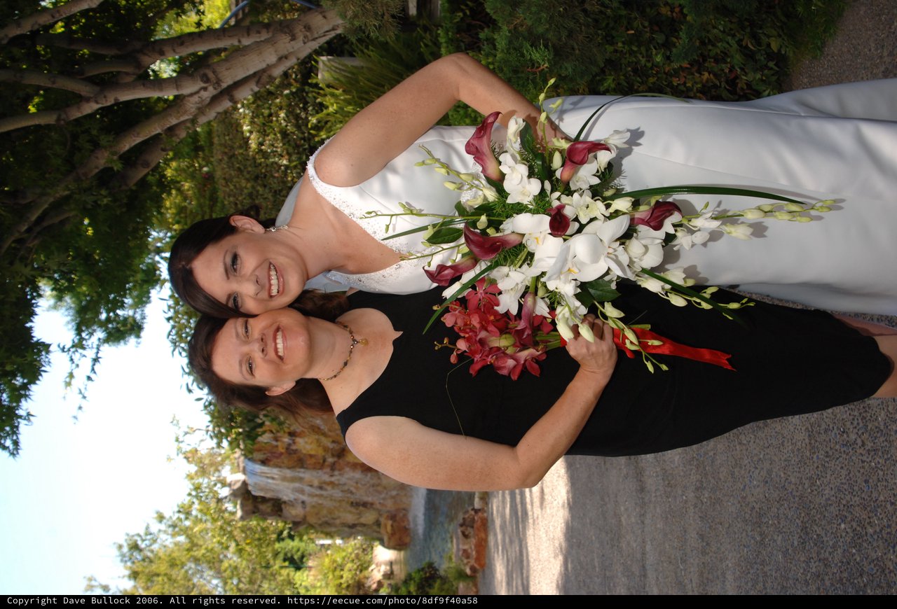 Bride and Guest Celebrate at Outdoor Garden Wedding