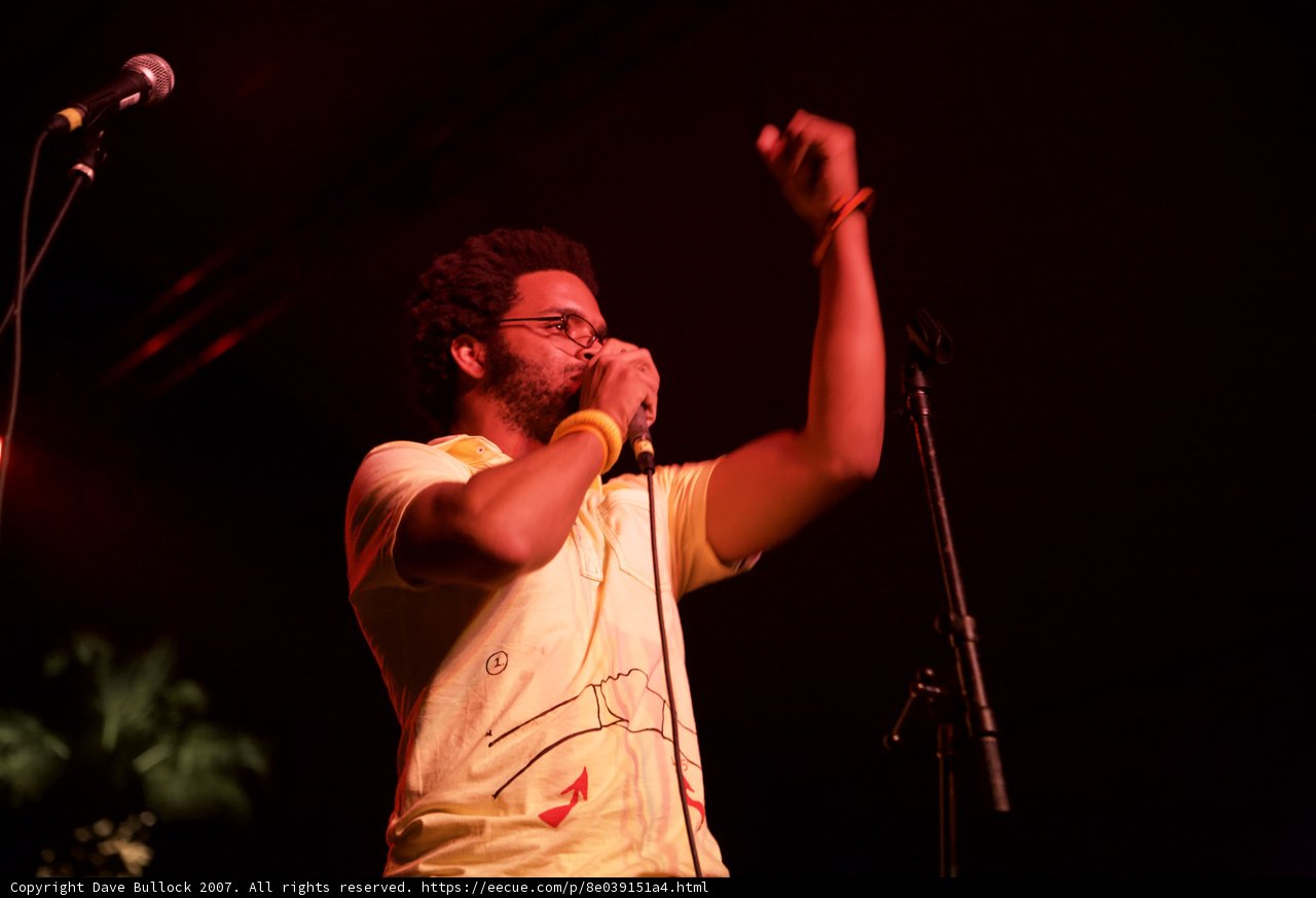 Yellow-Shirted Entertainer with Microphone