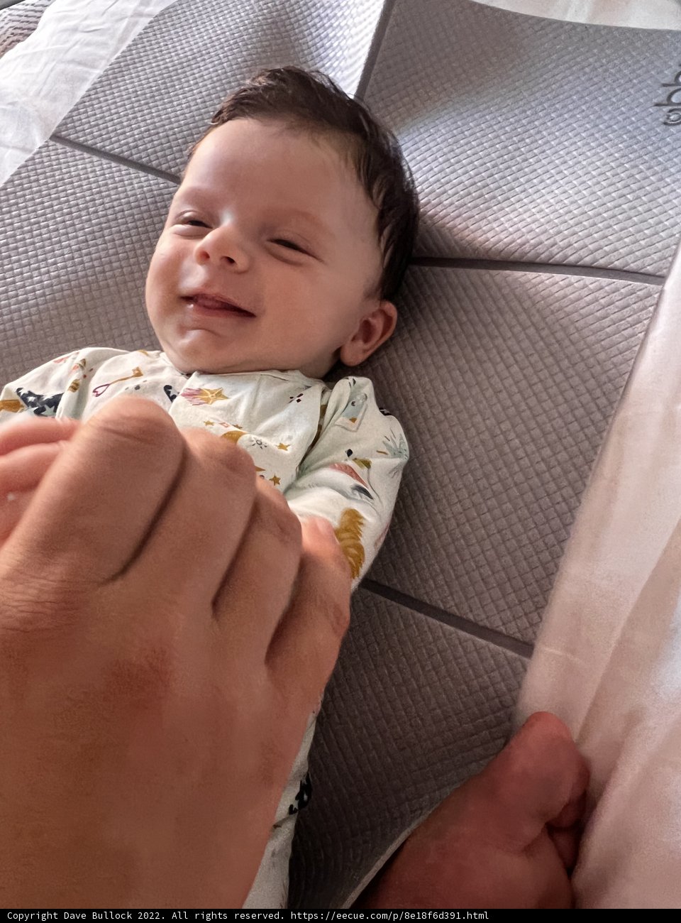 Joyful Baby on Cozy Bed