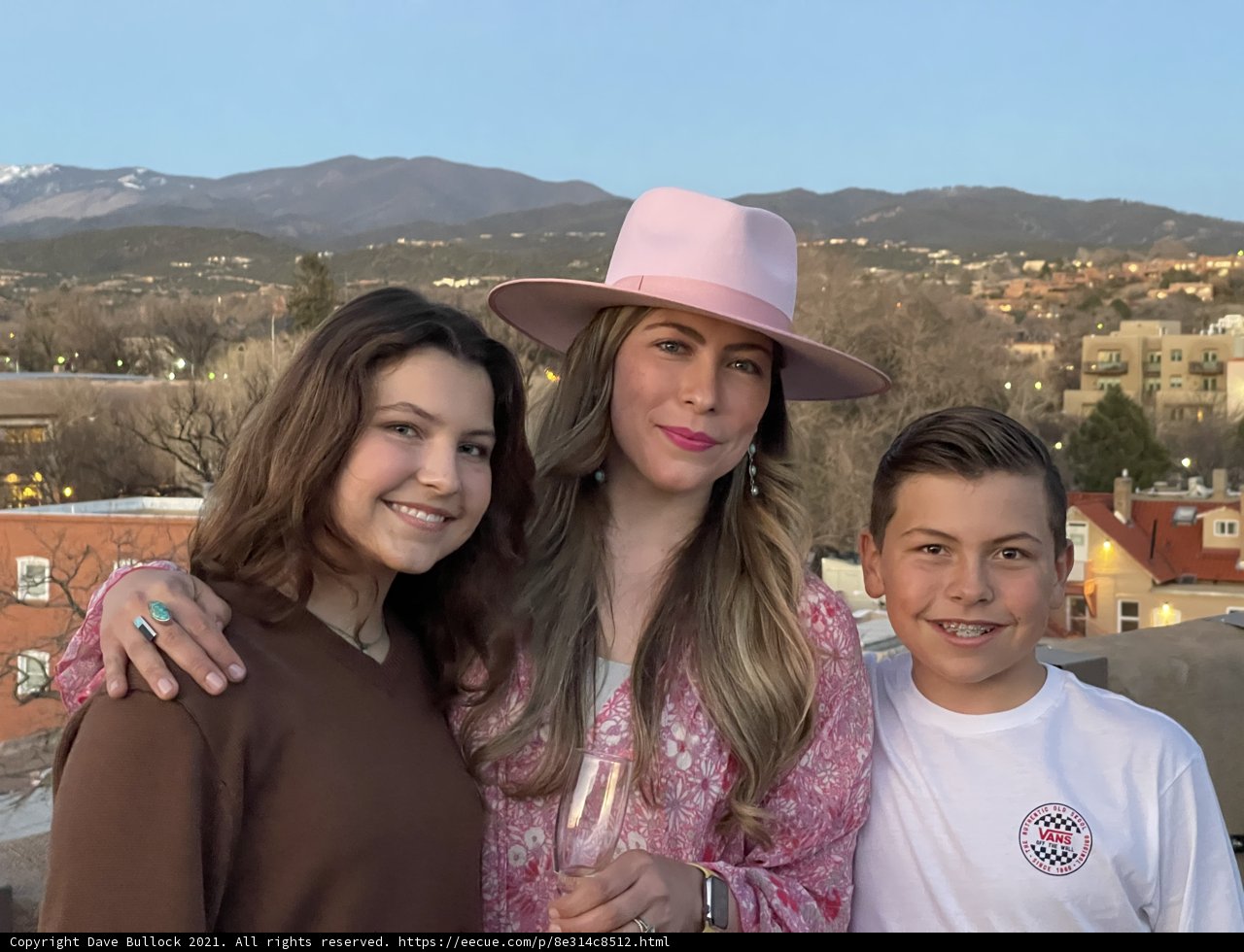 Three Smiling Friends with Hats in Santa Fe