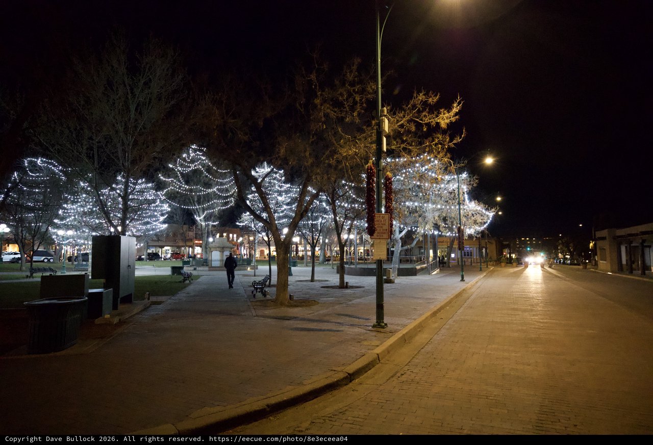 Festive Holiday Lights Illuminate Empty Town Square at Night