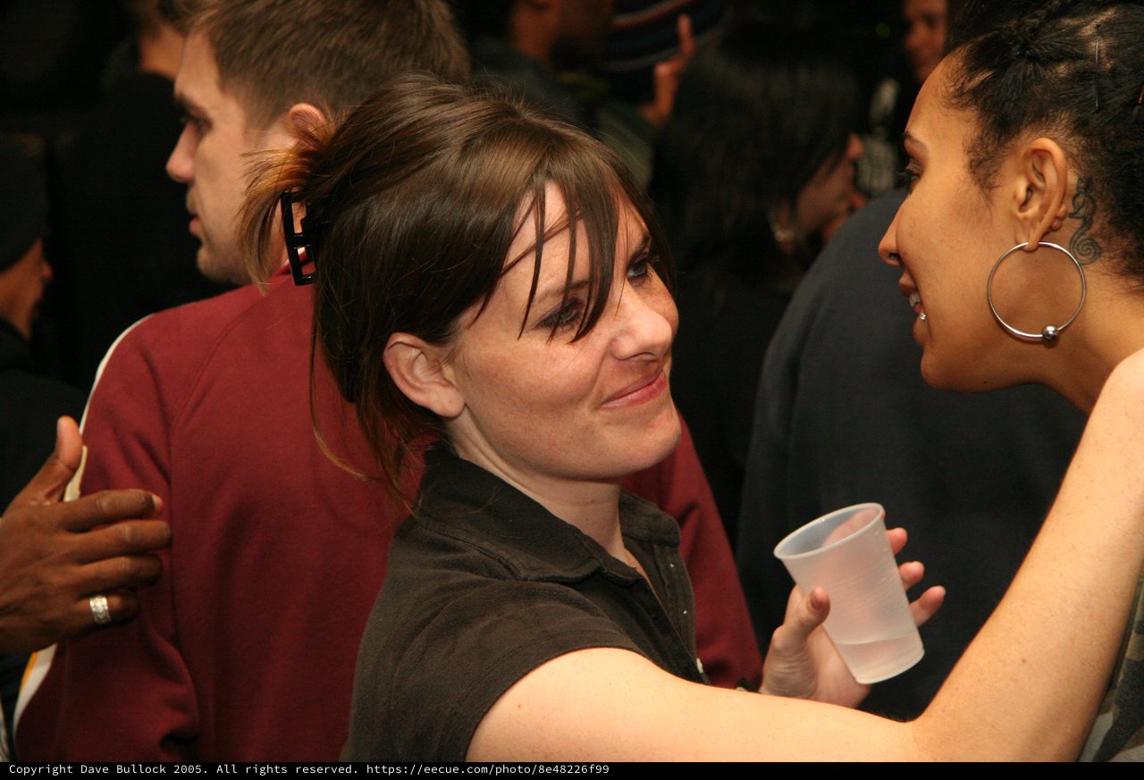Candid Party Conversation Between Two Women