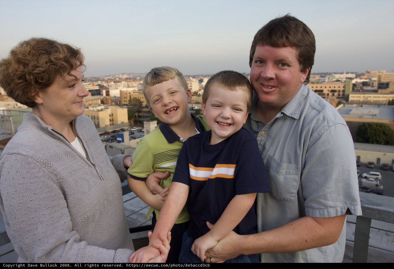 Family Portrait on Urban Rooftop at Dusk