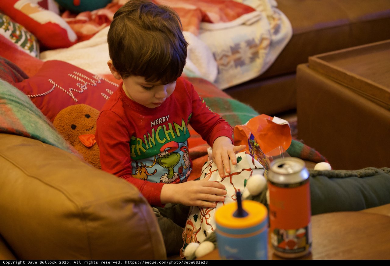 Christmas Morning Joy: Child Opening Holiday Gifts