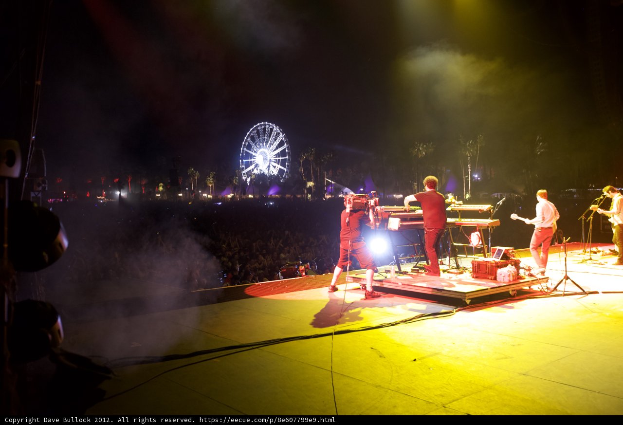 Nighttime Concert with Ferris Wheel Backdrop