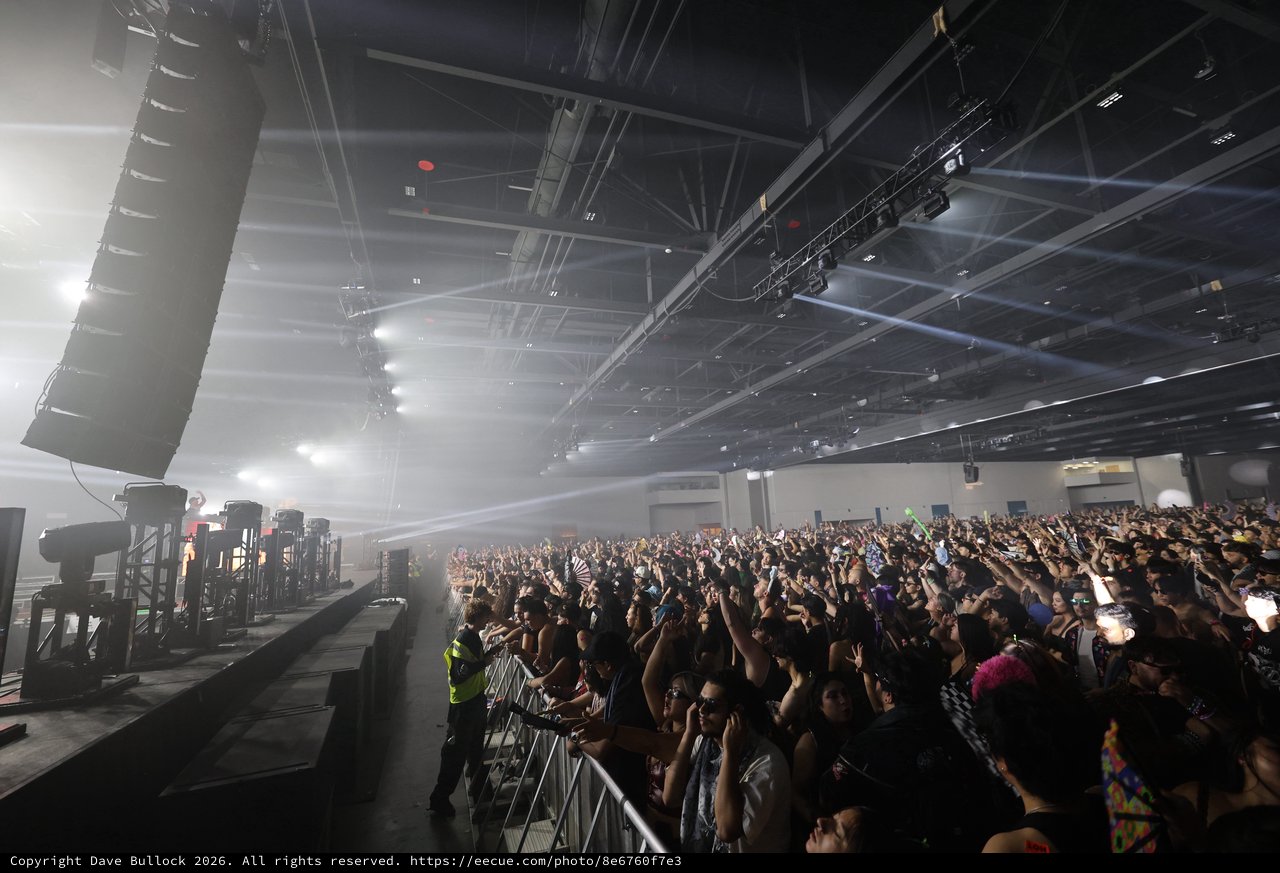 Massive Indoor EDM Crowd Bathed in Stage Light