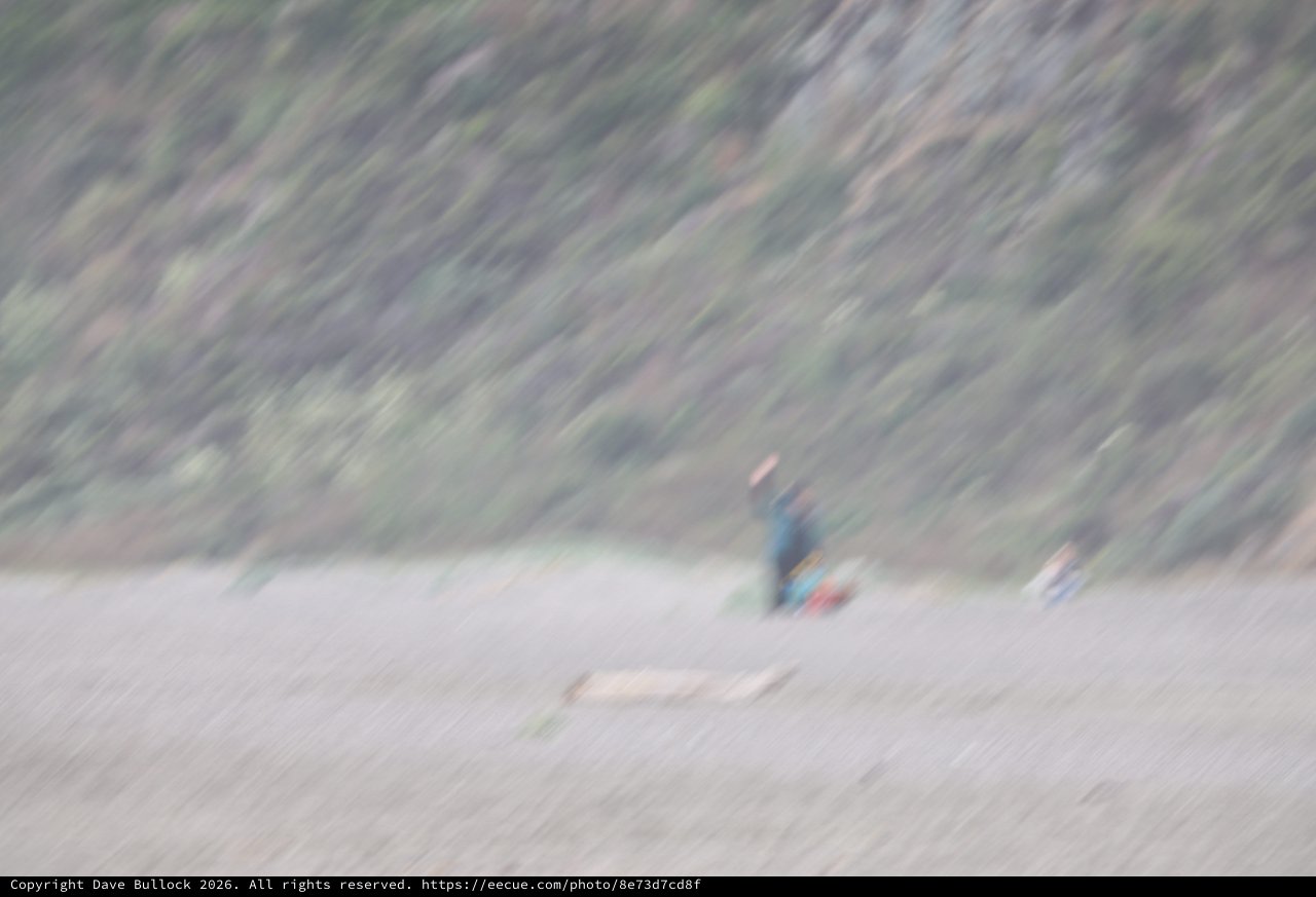 Solitary Camper on Remote Rocky Beach Shore