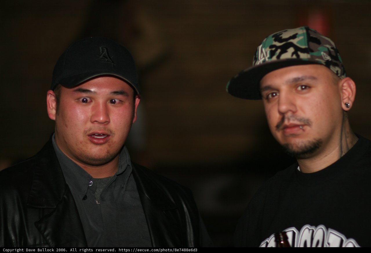 Two Men Sporting Baseball Caps