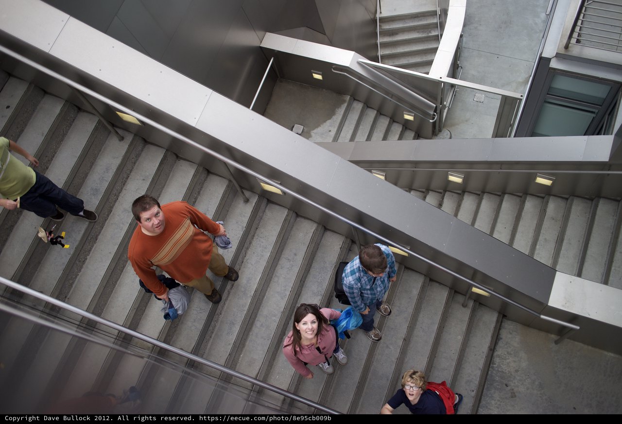 Family Ascending Modern Staircase from Above