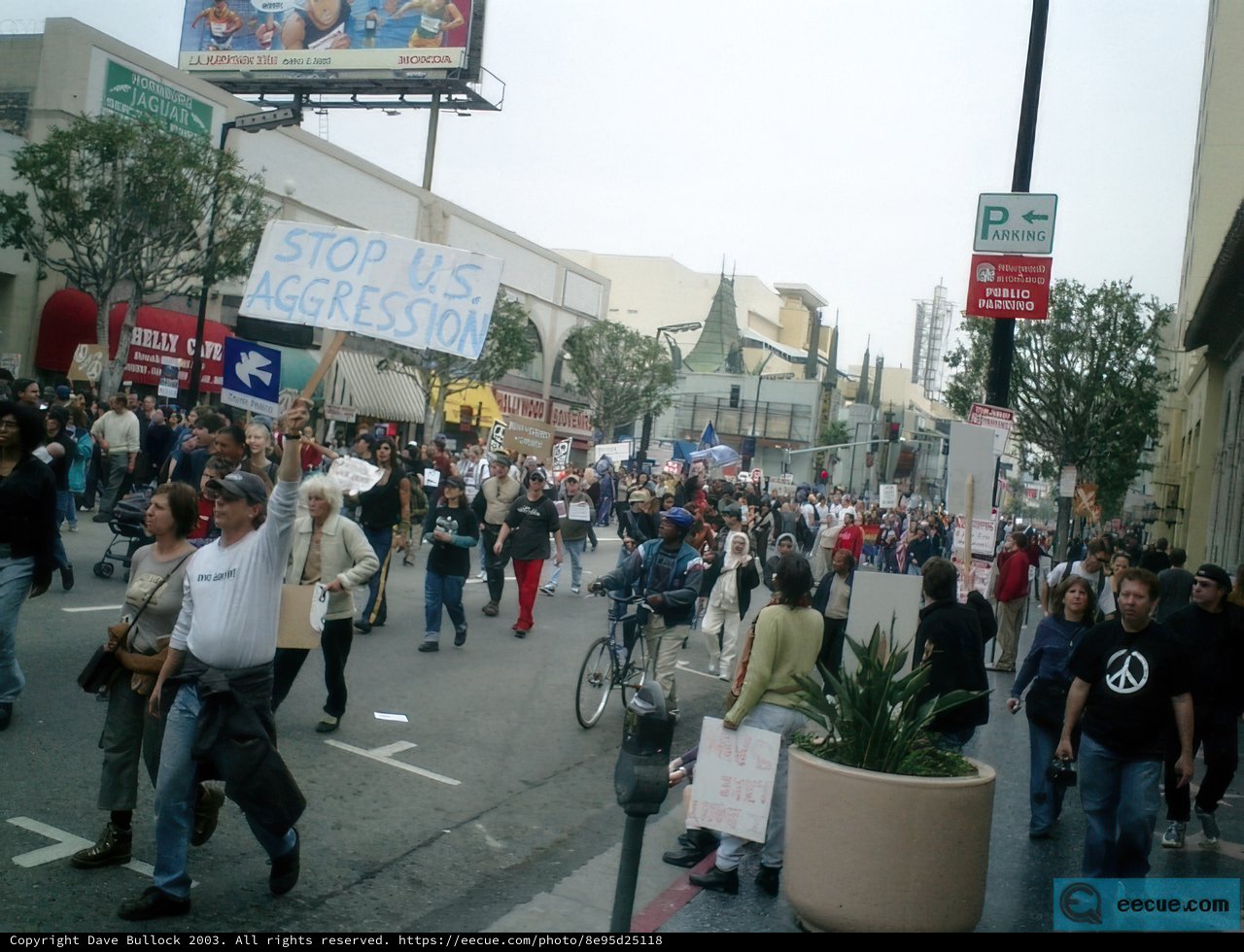 Protestors march through bustling city streets