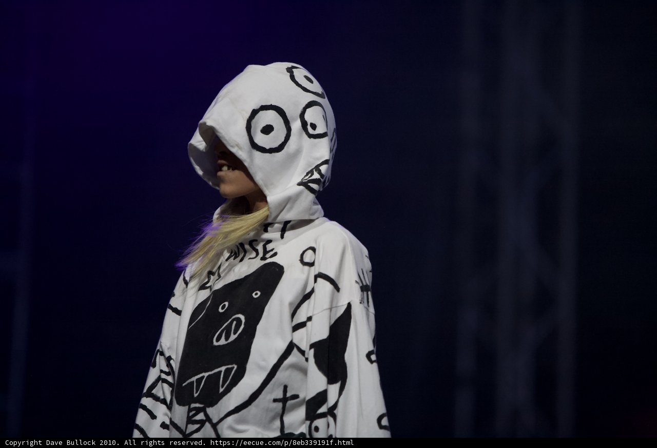 Hooded and Painted Performer Struts Down Coachella Runway