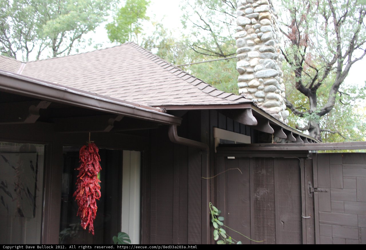 Quaint Brown House with a Striking Red Door