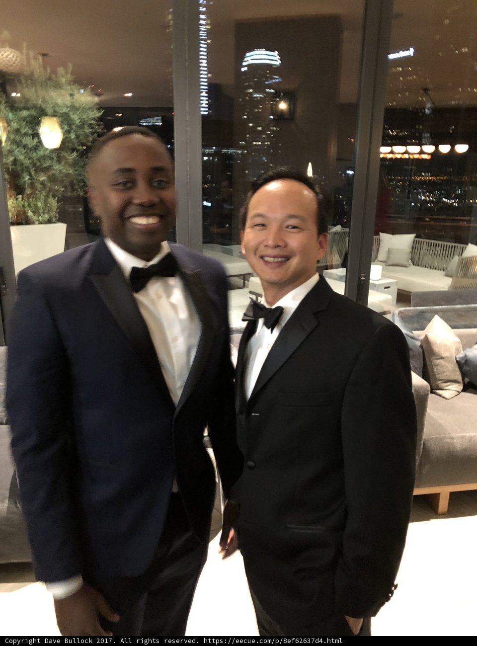 Two Men in Tuxedos Strike a Pose