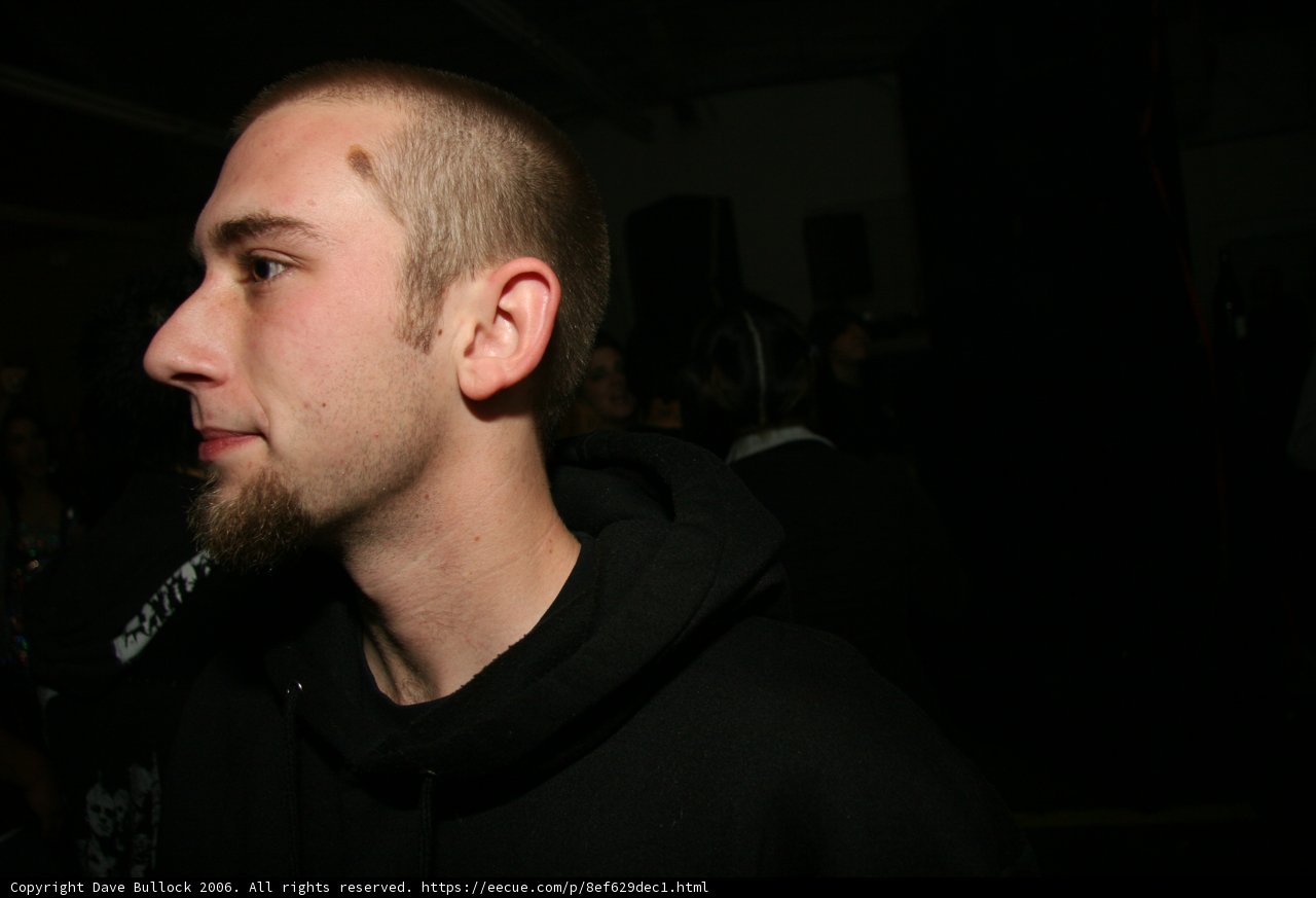Shaved Head and Black Hoodie