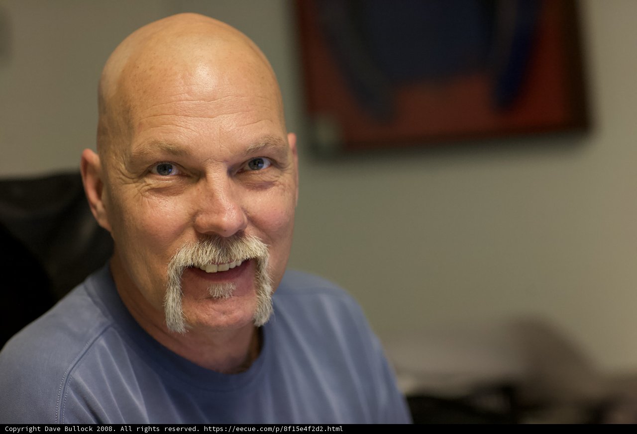 Bald and Mustachioed at the APC Office
