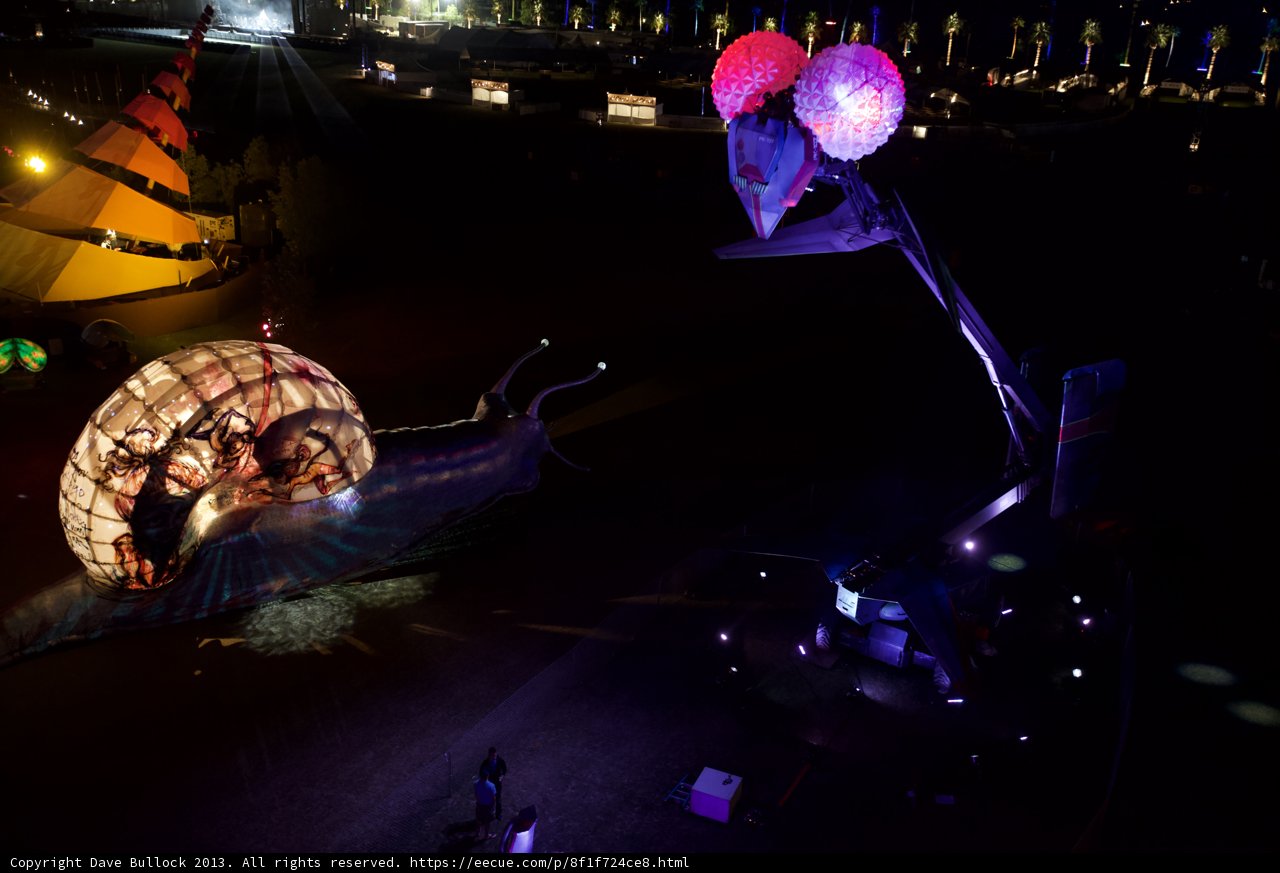 Illuminated Snail and Human Sculpture